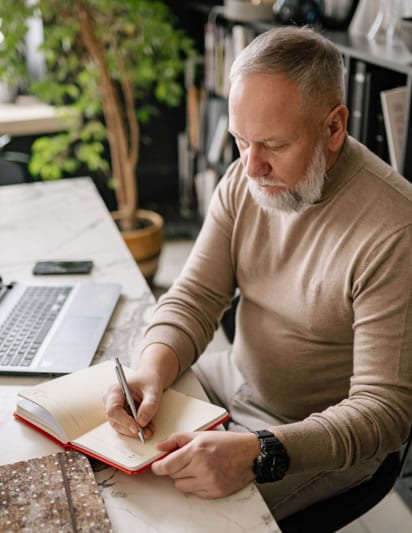 in house technical team image of a man writing specs